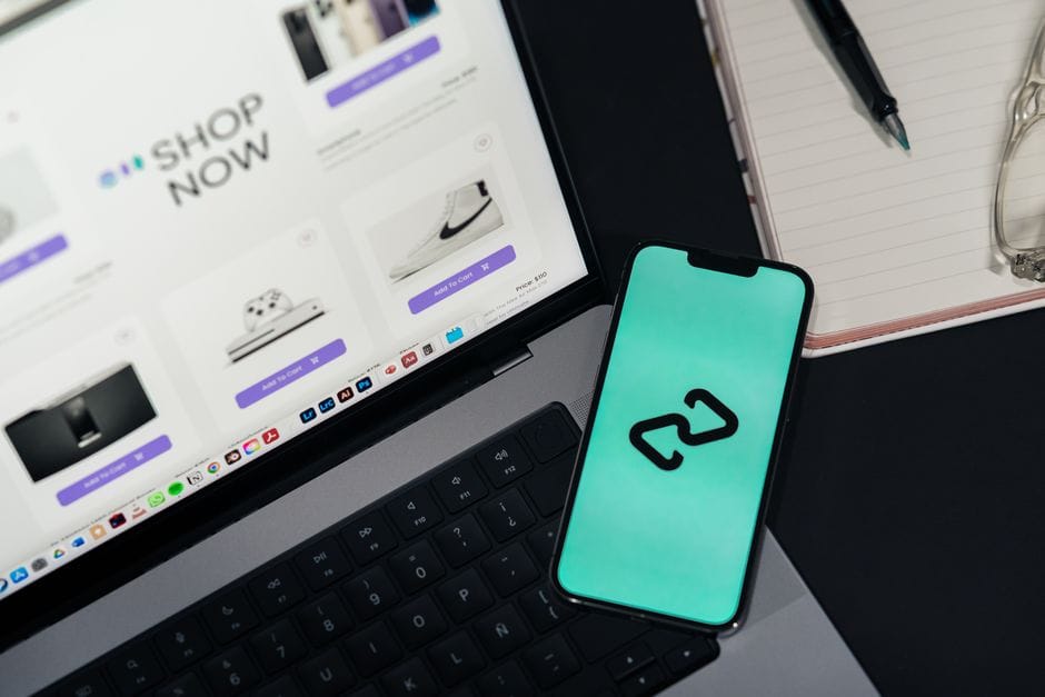 Types of Android App Development A software developer workspace with code and mobile app mockups.